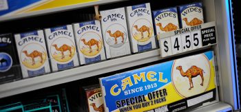 Retail store cigarette display showing special offer for Camel cigarettes